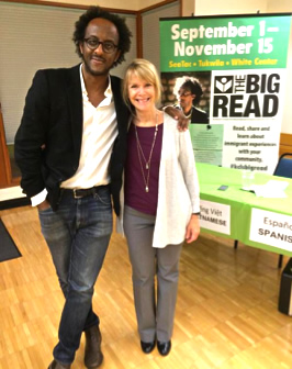 Author Dinaw Mengestu posing with a Big Read programmer