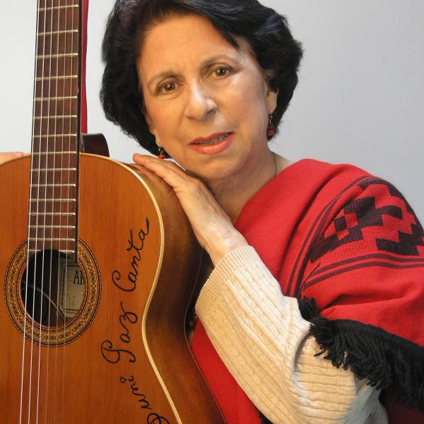 Woman holding a guitar. 