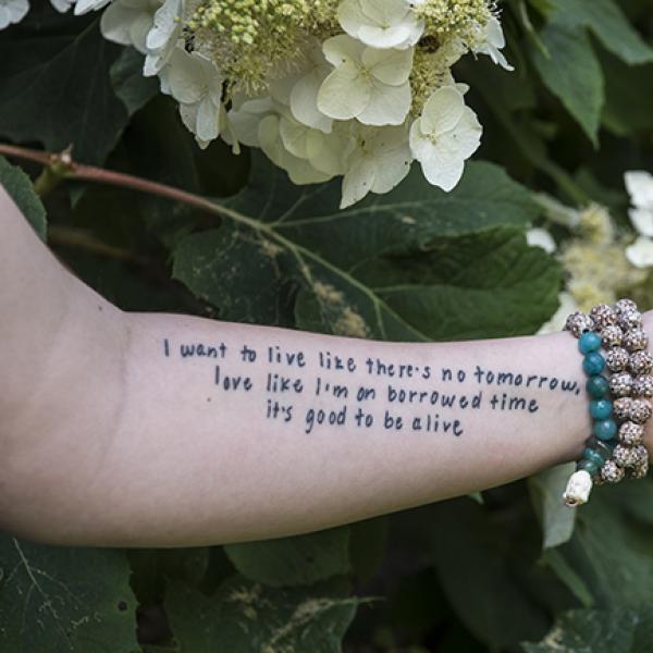 A tattooed arm belonging to a suicide survivor