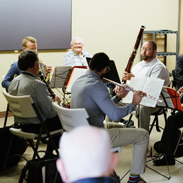 Musicians playing for an elderly audience