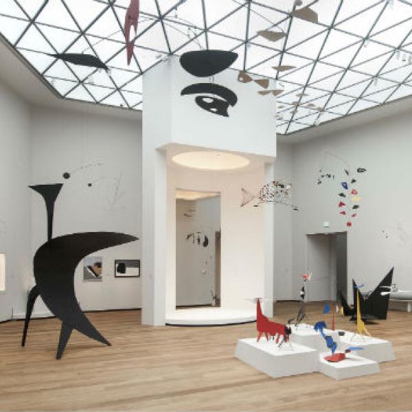 Museum filled with sculptures and mobiles