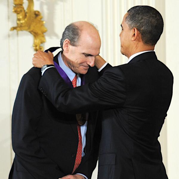 Singer and Songwriter James Taylor receives the 2010 National Medal of Arts from President Barack Obama