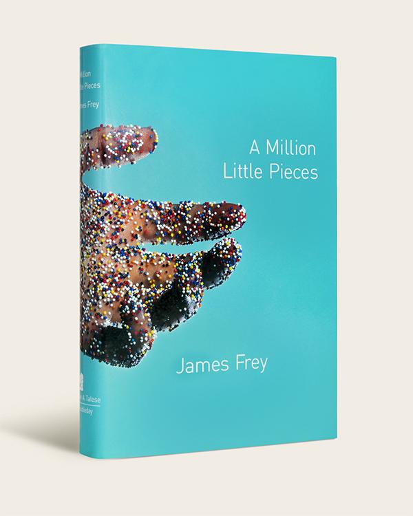 Blue book cover with extended hand covered in rainbow sprinkles
