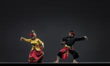 A female and male Asian dancer performing traditional dance.