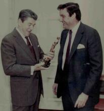 Frank Hodsoll shows Ronald Reagan the honorary Academy Award for the National Endowment for the Arts