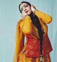South Asian dancer in traditional dance pose.
