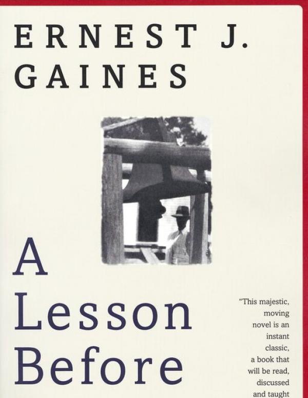 A Lesson Before Dying Book Cover - typographic layout with author name and book title with small image of an African American man standing beneath a wooden structure